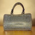 GOLDEN AND WHITE STONEWORK HANDHELD EVENING BAG